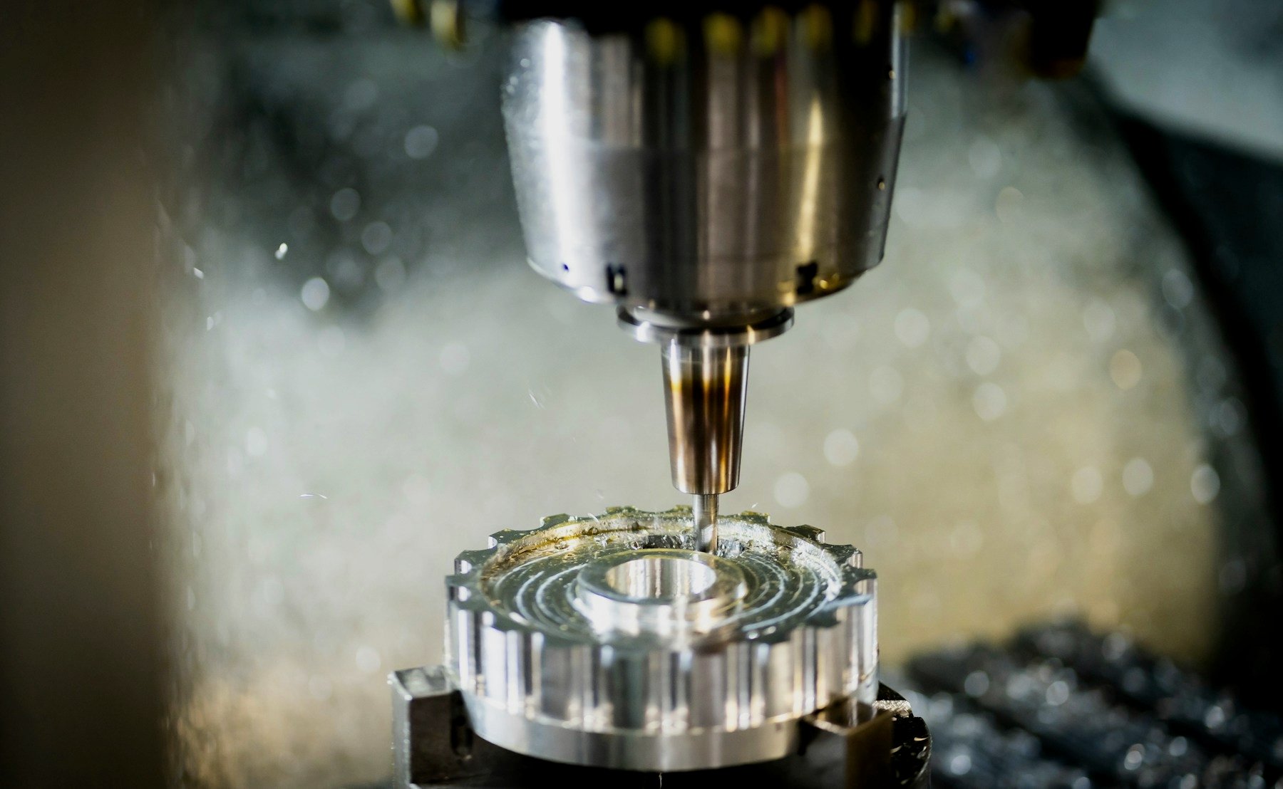 A milling machine cutting a precision metal part